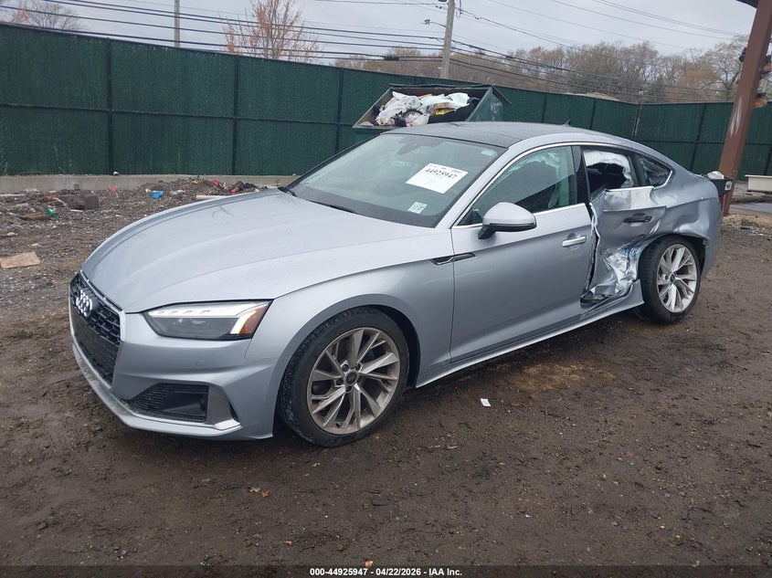 2023 Audi A5 VIN WAUCBCF54PA017980 IAAI salvage auction — LEFT REAR, Salvage (New Jersey), sold $8,400 on 2026-07-28 (photo 2)