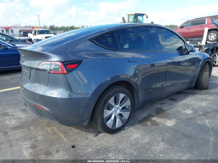 2023 Tesla Model y VIN 7SAYGDEE7PA110646 IAAI salvage auction — UNDERCARRIAGE, Rebuildable (Florida), sold $14,200 on 2026-07-30 (photo 4)