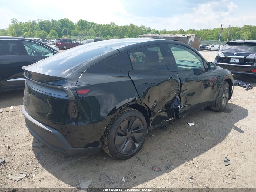 2026 Tesla Model y VIN 7SAYGDED1TA664458 IAAI salvage auction — SIDE, Salvage Title, sold $17,600 on 2026-07-29 (photo 4)