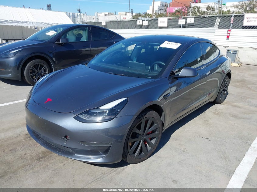 2023 Tesla Model 3 VIN 5YJ3E1EA6PF692010 IAAI salvage auction — SIDE, Salvage (Arizona), sold $4,750 on 2026-07-10 (photo 2)