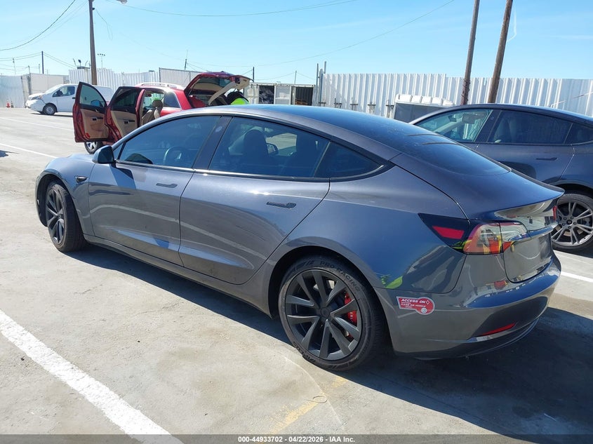 2023 Tesla Model 3 VIN 5YJ3E1EA6PF692010 IAAI salvage auction — SIDE, Salvage (Arizona), sold $4,750 on 2026-07-10 (photo 3)