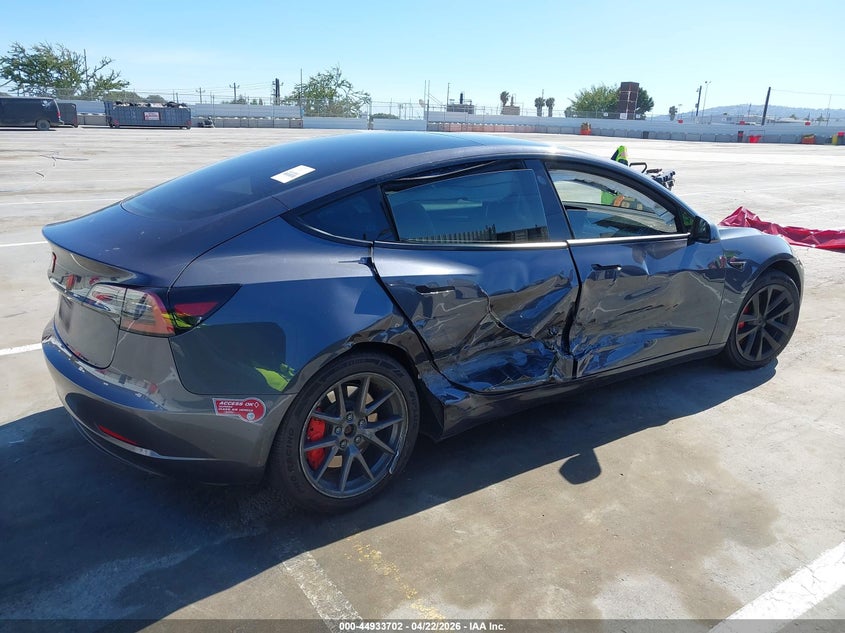 2023 Tesla Model 3 VIN 5YJ3E1EA6PF692010 IAAI salvage auction — SIDE, Salvage (Arizona), sold $4,750 on 2026-07-10 (photo 4)