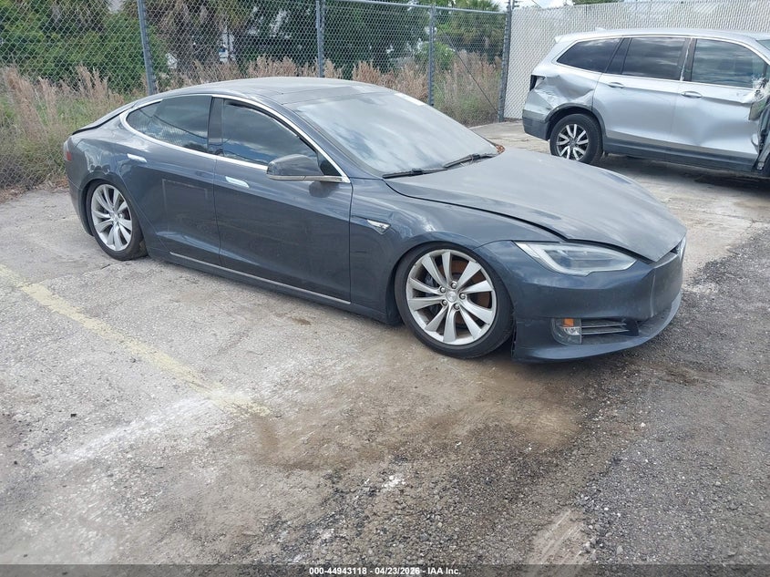 2016 Tesla Model s VIN 5YJSA1E29GF145331 IAAI salvage auction — LEFT SIDE, Clear (Florida), sold $2,100 on 2026-07-08 (photo 1)