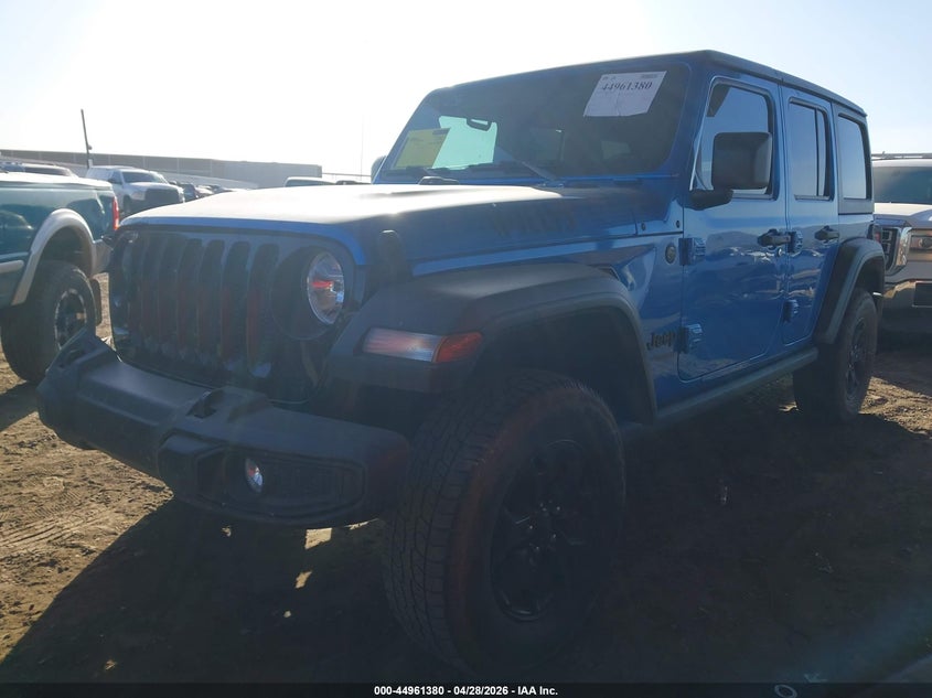 2021 Jeep Wrangler / VIN 1C4HJXDG3MW720637 IAAI salvage auction — UNKNOWN, Salvage Title, sold $7,100 on 2026-08-13 (photo 2)