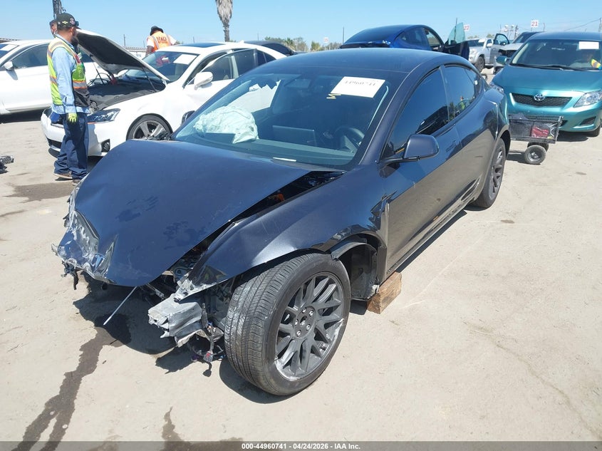 2025 Tesla Model 3 VIN 5YJ3E1EA9SF013033 IAAI salvage auction — RIGHT FRONT, Salvage Title, sold $7,200 on 2026-07-08 (photo 2)