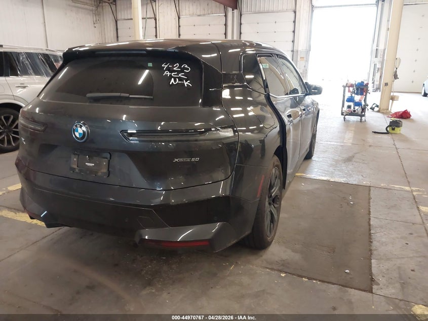 2023 BMW Ix VIN WB523CF03PCM92343 IAAI salvage auction — FRONT END, Salvage (Oregon), sold $18,400 on 2026-07-20 (photo 4)