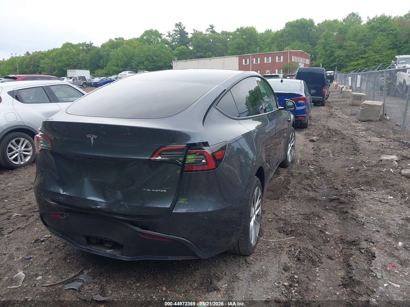2023 Tesla Model y VIN 7SAYGDEE7PA206602 IAAI salvage auction — REAR END, Salvage (Massachusetts), sold $12,600 on 2026-07-30 (photo 4)