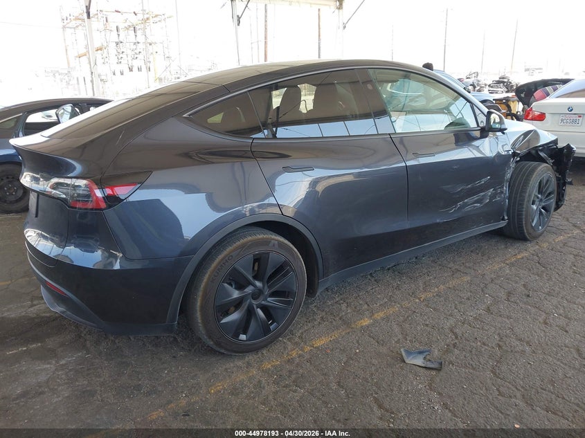 2024 Tesla Model y VIN 7SAYGDED6RF132764 IAAI salvage auction — SIDE, Salvage (California), sold $12,350 on 2026-07-16 (photo 4)