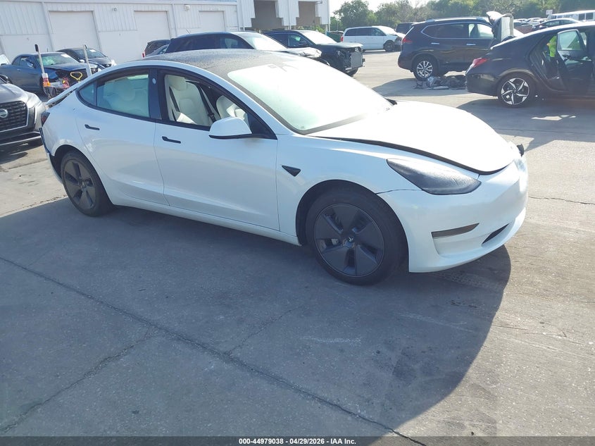 2023 Tesla Model 3 VIN 5YJ3E1EA3PF517133 IAAI salvage auction — FRONT & REAR, Salvage Title, sold $6,100 on 2026-07-09 (photo 1)