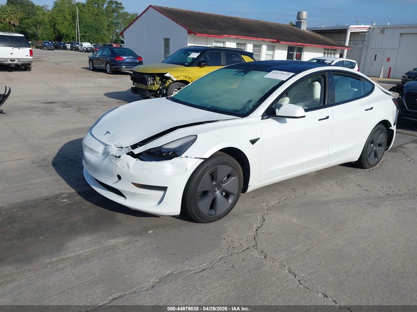 2023 Tesla Model 3 VIN 5YJ3E1EA3PF517133 IAAI salvage auction — FRONT & REAR, Salvage Title, sold $6,100 on 2026-07-09 (photo 2)