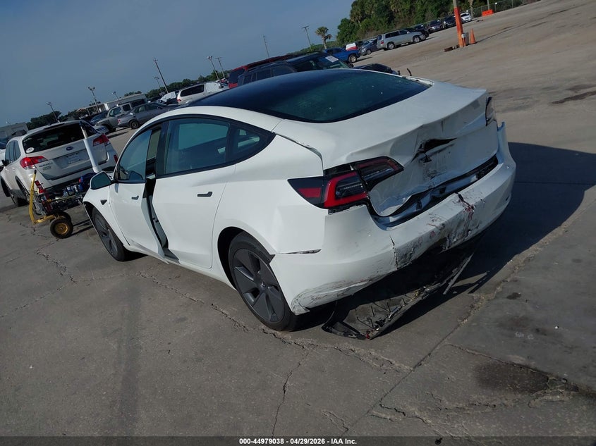2023 Tesla Model 3 VIN 5YJ3E1EA3PF517133 IAAI salvage auction — FRONT & REAR, Salvage Title, sold $6,100 on 2026-07-09 (photo 3)