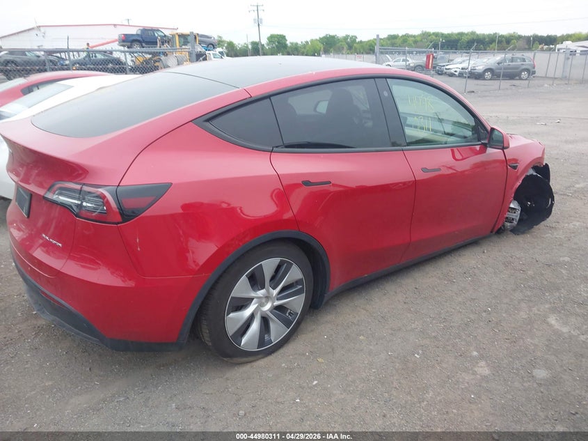 2022 Tesla Model y VIN 7SAYGDEEXNA018797 IAAI salvage auction — RIGHT FRONT, Salvage Title, sold $10,700 on 2026-07-16 (photo 4)