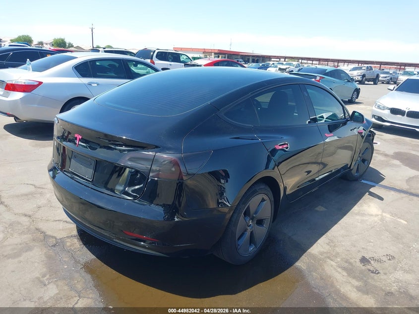 2023 Tesla Model 3 VIN 5YJ3E1EA6PF669780 IAAI salvage auction — RIGHT FRONT, Salvage (Arizona), sold $8,100 on 2026-07-11 (photo 4)