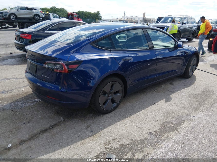 2022 Tesla Model 3 VIN 5YJ3E1EB2NF208047 IAAI salvage auction — SIDE, Salvage (Missouri), sold $9,450 on 2026-07-14 (photo 4)