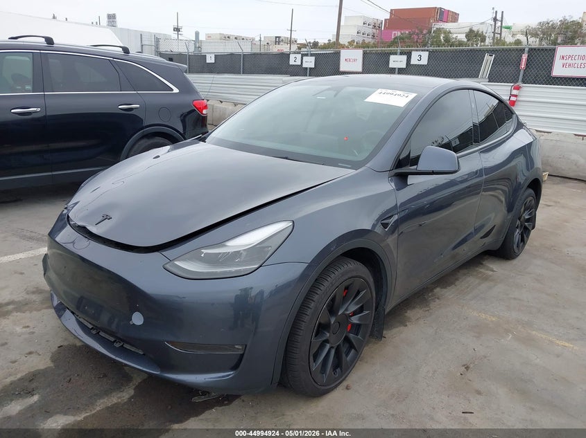 2023 Tesla Model y VIN 7SAYGDEDXPF966310 IAAI salvage auction — RIGHT FRONT, Salvage (Arizona), sold $8,700 on 2026-08-01 (photo 2)