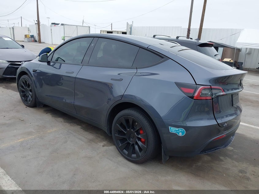 2023 Tesla Model y VIN 7SAYGDEDXPF966310 IAAI salvage auction — RIGHT FRONT, Salvage (Arizona), sold $8,700 on 2026-08-01 (photo 3)