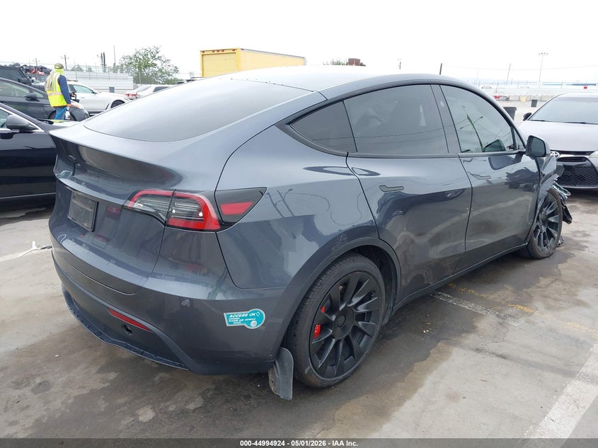 2023 Tesla Model y VIN 7SAYGDEDXPF966310 IAAI salvage auction — RIGHT FRONT, Salvage (Arizona), sold $8,700 on 2026-08-01 (photo 4)