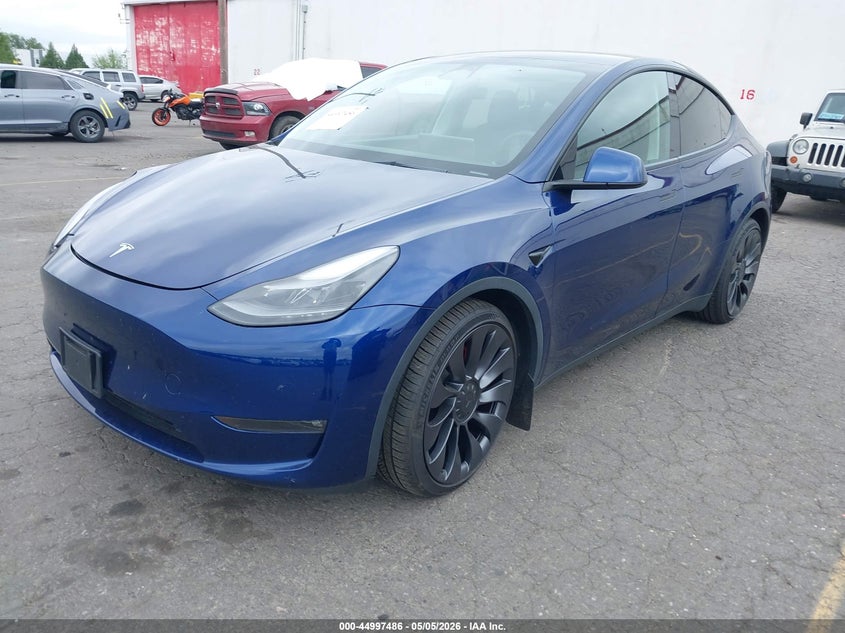 2023 Tesla Model y VIN 7SAYGDEF9PF664833 IAAI salvage auction — RIGHT SIDE, Salvage (Oregon), sold $12,900 on 2026-07-30 (photo 2)