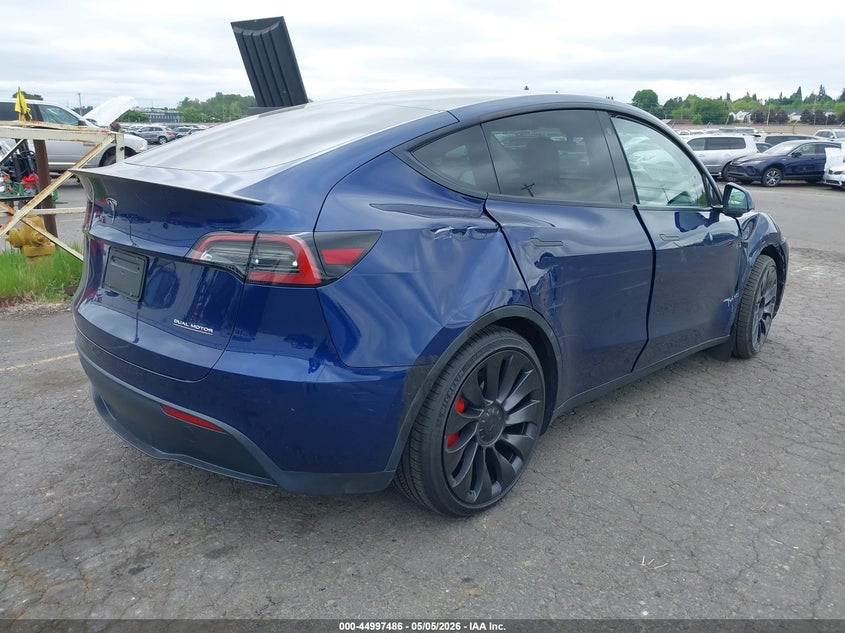 2023 Tesla Model y VIN 7SAYGDEF9PF664833 IAAI salvage auction — RIGHT SIDE, Salvage (Oregon), sold $12,900 on 2026-07-30 (photo 4)