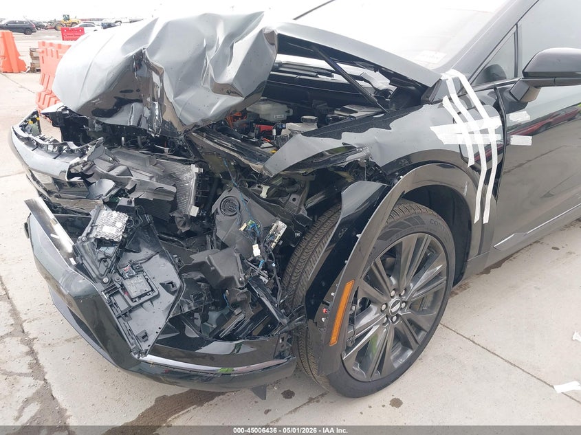 2025 Cadillac Optiq VIN 3GYK3GMR2SS146147 IAAI salvage auction — LEFT SIDE, Salvage (Texas), sold $13,600 on 2026-07-15 (photo 6)