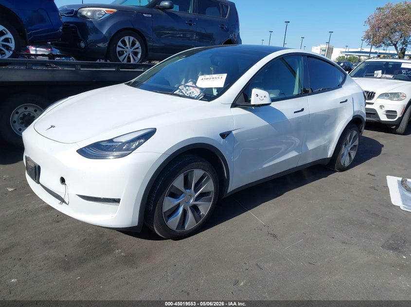 2023 Tesla Model y VIN 7SAYGDEE9PA034752 IAAI salvage auction — LEFT & RIGHT, Salvage Certificate (California), sold $7,100 on 2026-07-10 (photo 2)