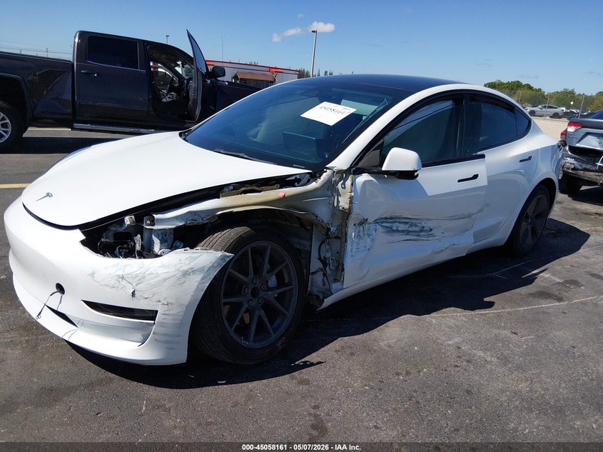 2023 Tesla Model 3 VIN 5YJ3E1EA3PF450095 IAAI salvage auction — SIDE, Rebuildable (Florida), sold $5,750 on 2026-07-09 (photo 2)