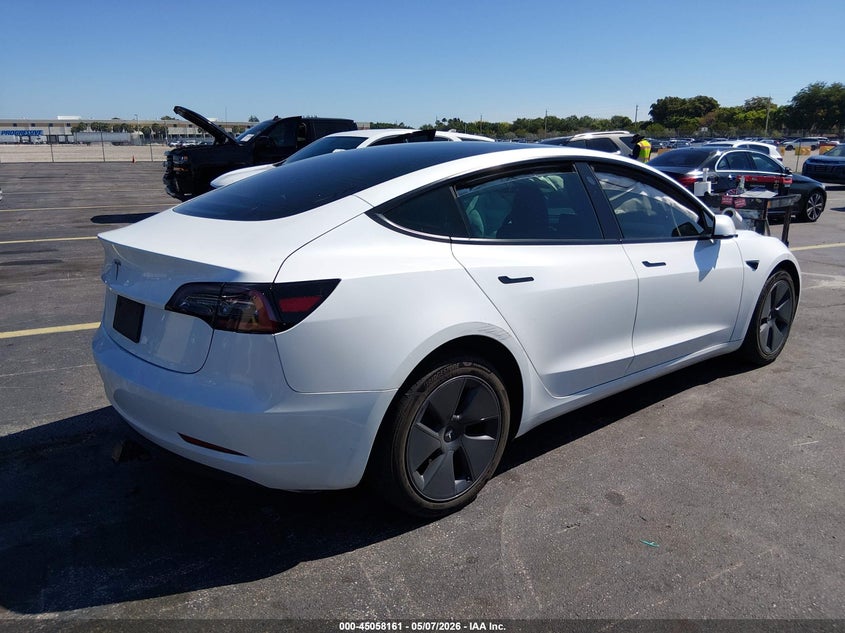 2023 Tesla Model 3 VIN 5YJ3E1EA3PF450095 IAAI salvage auction — SIDE, Rebuildable (Florida), sold $5,750 on 2026-07-09 (photo 4)