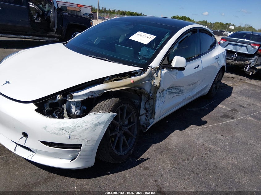 2023 Tesla Model 3 VIN 5YJ3E1EA3PF450095 IAAI salvage auction — SIDE, Rebuildable (Florida), sold $5,750 on 2026-07-09 (photo 6)