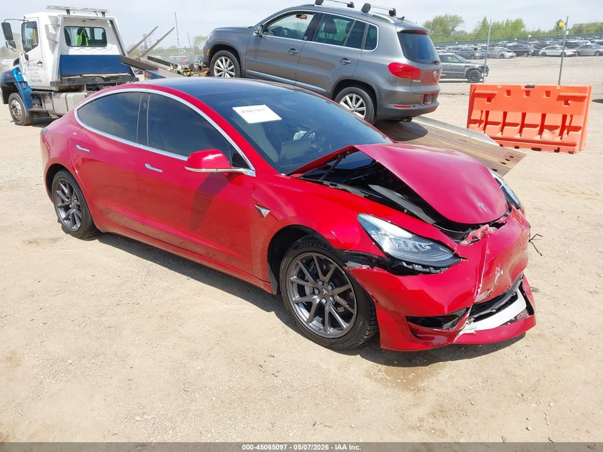 2018 Tesla Model 3 VIN 5YJ3E1EB9JF099581 IAAI salvage auction — FRONT END, Salvage (Illinois), sold $2,150 on 2026-07-09 (photo 1)