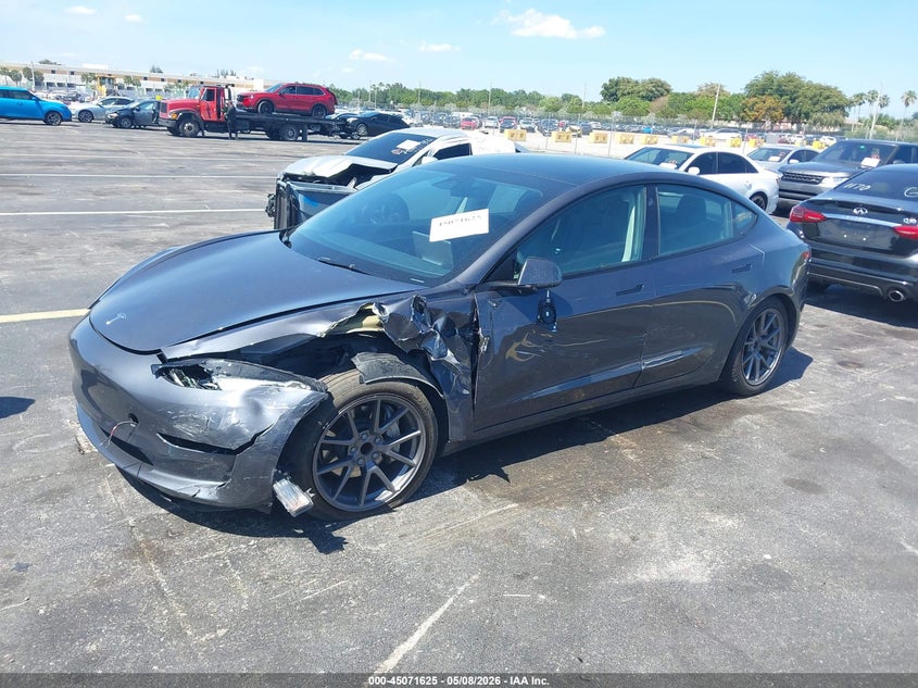 2023 Tesla Model 3 VIN 5YJ3E1EA7PF566545 IAAI salvage auction — LEFT SIDE, Rebuildable (Florida), sold $5,900 on 2026-07-29 (photo 2)