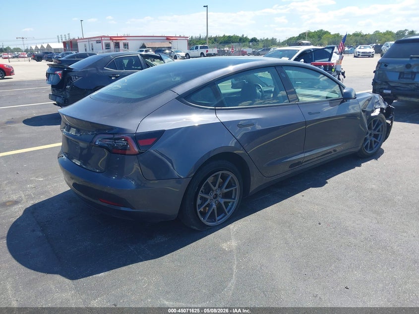 2023 Tesla Model 3 VIN 5YJ3E1EA7PF566545 IAAI salvage auction — LEFT SIDE, Rebuildable (Florida), sold $5,900 on 2026-07-29 (photo 4)