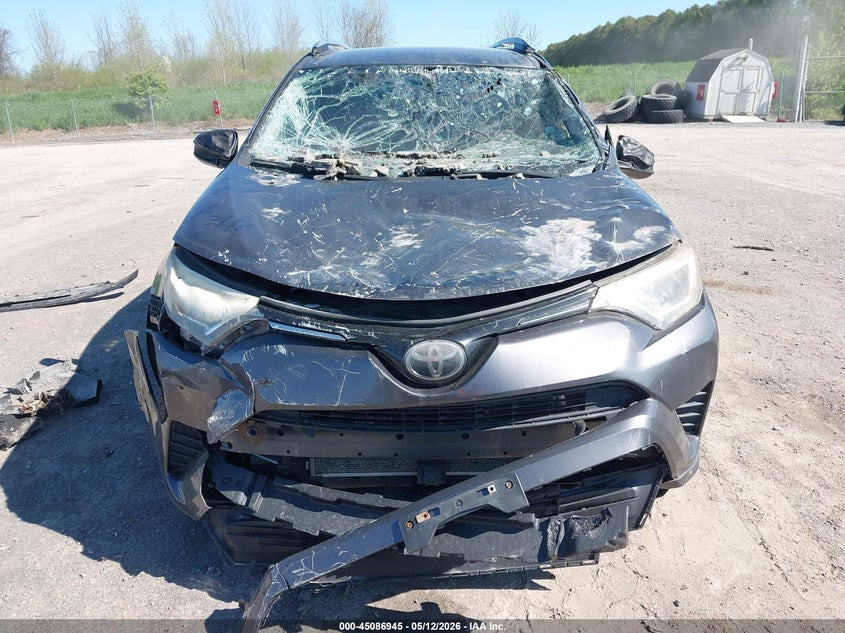 2018 Toyota Rav 4 VIN JTMBFREV1JJ238886 IAAI salvage auction — EXTERIOR BURN, Mv-907A (New York), sold $3,850 on 2026-07-09 (photo 6)
