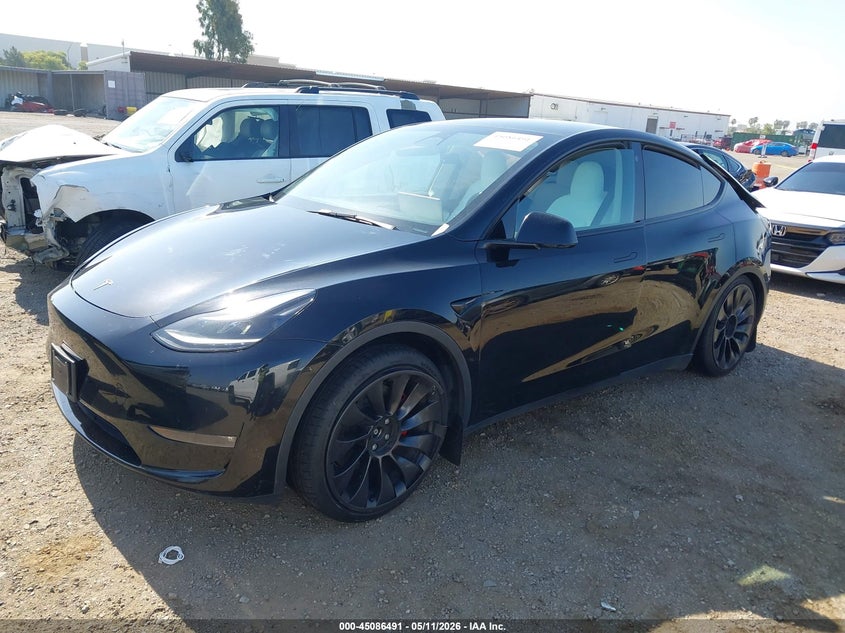 2023 Tesla Model y VIN 7SAYGDEF4PF624014 IAAI salvage auction — RIGHT SIDE, Salvage (California), sold $7,400 on 2026-07-06 (photo 2)