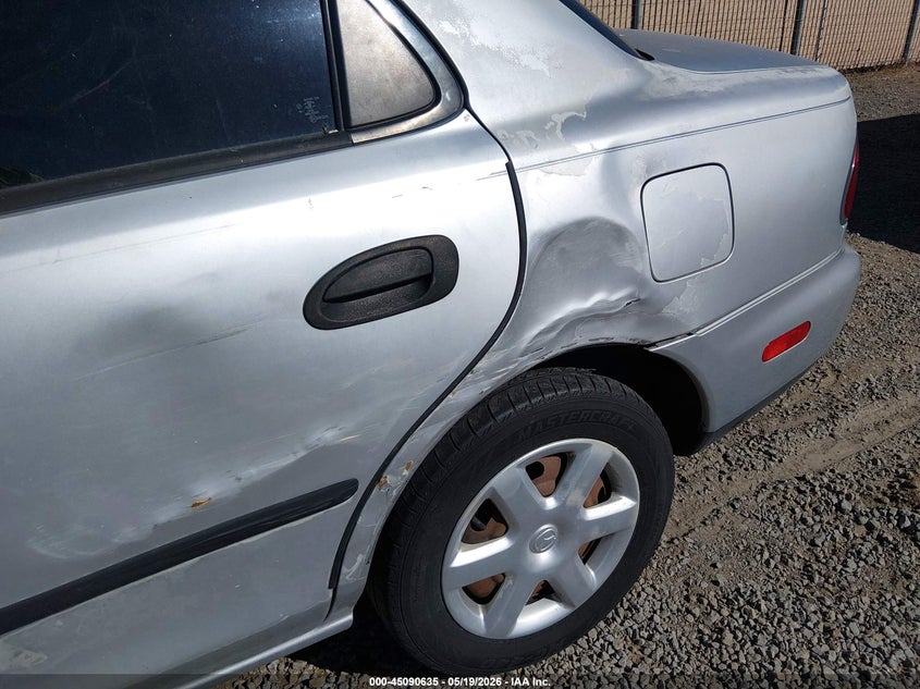 1998 Mazda Protege VIN JM1BC1412W0171947 IAAI salvage auction — NORMAL WEAR, Regular (Nevada), sold $100 on 2026-07-24 (photo 6)