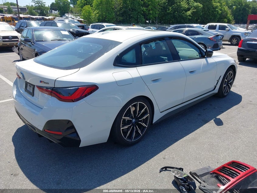 2024 BMW I4 VIN WBY33AW06RFS80467 IAAI salvage auction — SIDE, Salvage (North Carolina), sold $14,000 on 2026-07-17 (photo 4)