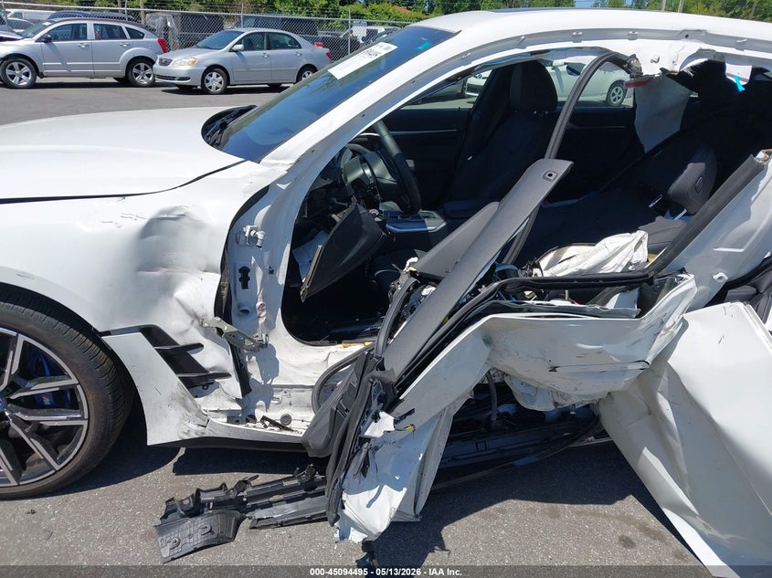 2024 BMW I4 VIN WBY33AW06RFS80467 IAAI salvage auction — SIDE, Salvage (North Carolina), sold $14,000 on 2026-07-17 (photo 6)