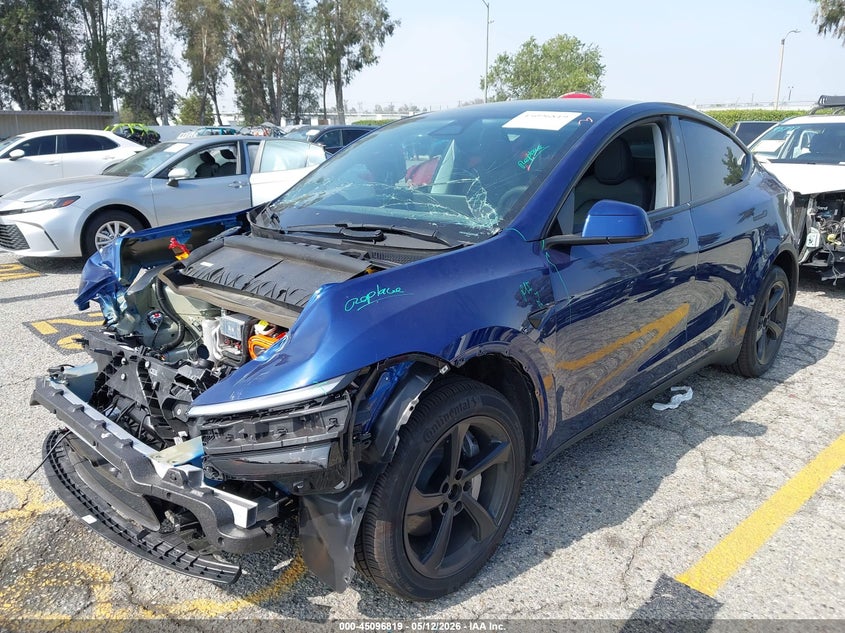 2026 Tesla Model y VIN 7SAYGDED9TF550890 IAAI salvage auction — FRONT & REAR, Salvage (California), sold $13,350 on 2026-07-07 (photo 2)