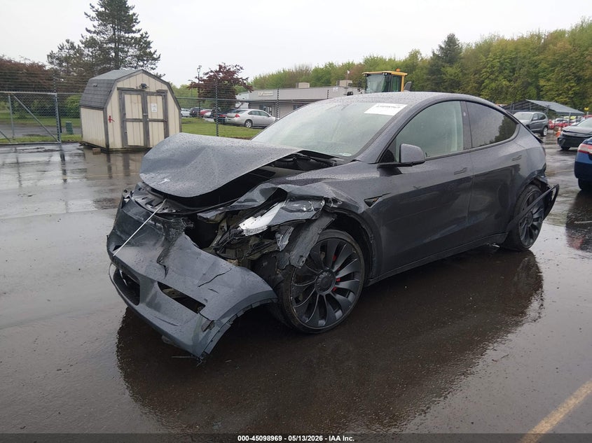 2023 Tesla Model y VIN 7SAYGDEF2PF912338 IAAI salvage auction — FRONT & REAR, Salvage (Idaho), sold $8,800 on 2026-07-30 (photo 2)