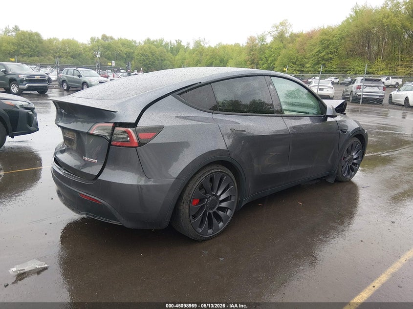 2023 Tesla Model y VIN 7SAYGDEF2PF912338 IAAI salvage auction — FRONT & REAR, Salvage (Idaho), sold $8,800 on 2026-07-30 (photo 4)