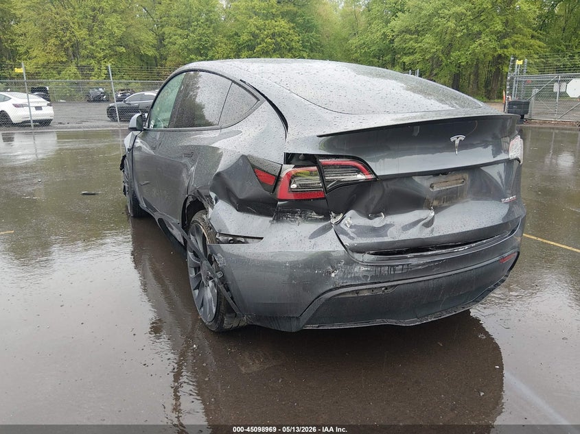 2023 Tesla Model y VIN 7SAYGDEF2PF912338 IAAI salvage auction — FRONT & REAR, Salvage (Idaho), sold $8,800 on 2026-07-30 (photo 6)