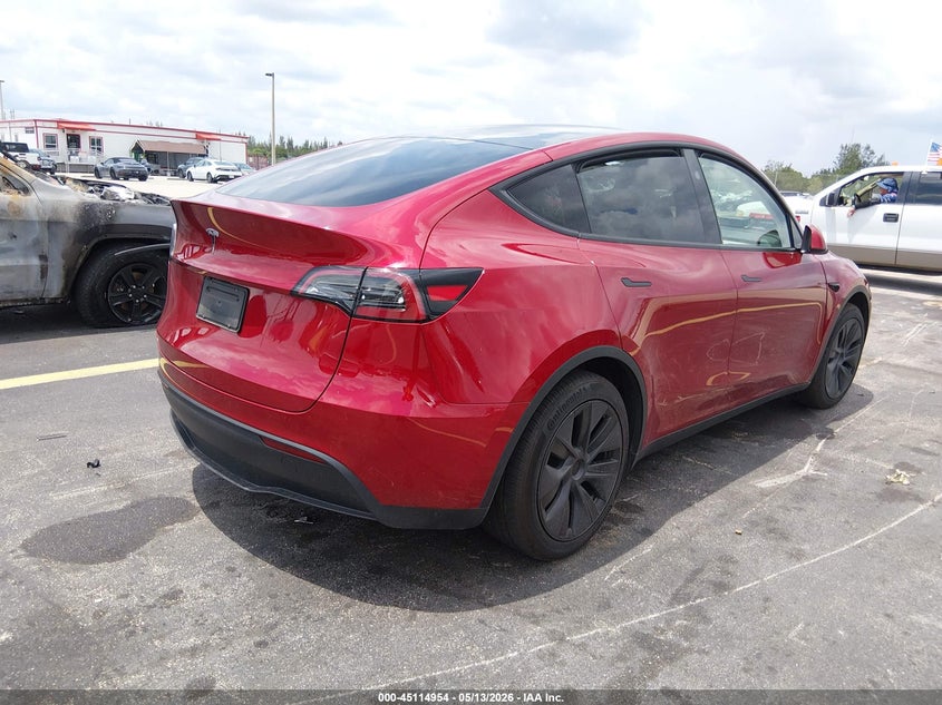2025 Tesla Model y VIN 7SAYGDED1SA349206 IAAI salvage auction — SIDE, Rebuildable (Florida), sold $11,050 on 2026-07-16 (photo 4)