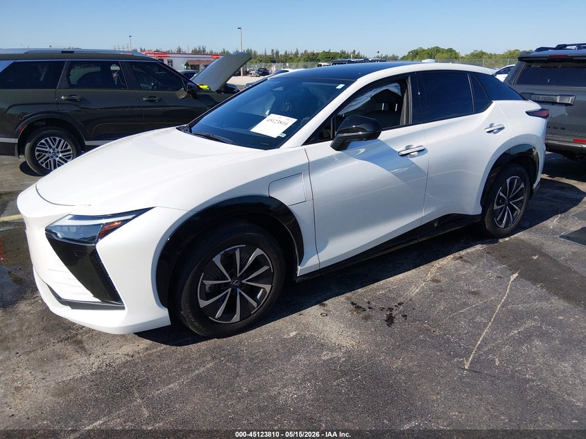 2024 Lexus Rz VIN JTJABABB7RA000472 IAAI salvage auction — SIDE, Rebuildable (Florida), sold $17,100 on 2026-07-16 (photo 2)