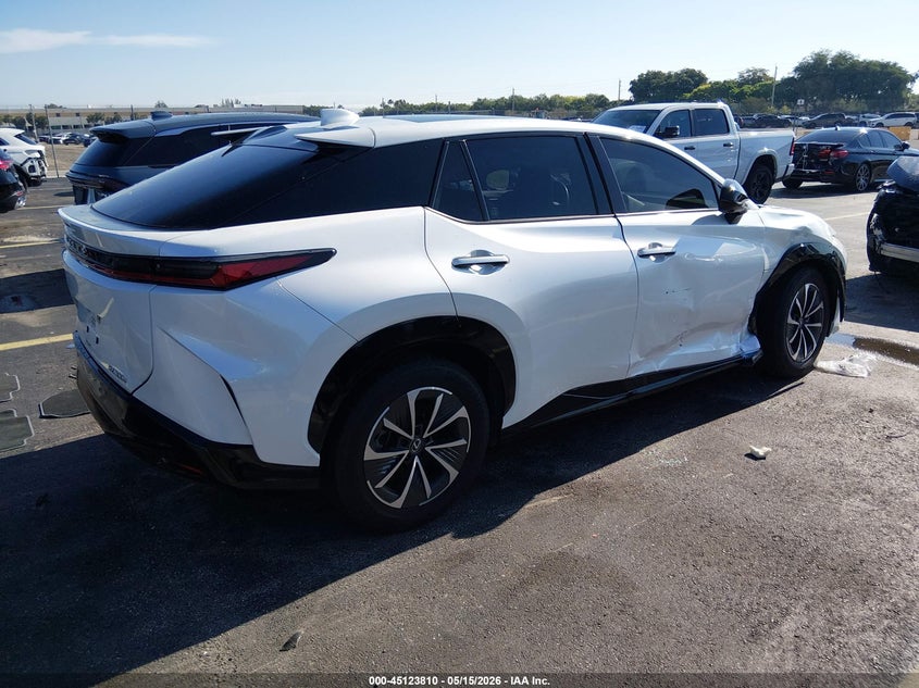 2024 Lexus Rz VIN JTJABABB7RA000472 IAAI salvage auction — SIDE, Rebuildable (Florida), sold $17,100 on 2026-07-16 (photo 4)