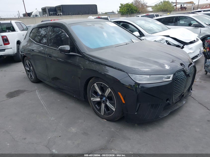 2023 BMW Ix VIN WB523CF06PCM54850 IAAI salvage auction — LEFT SIDE, Salvage Title, sold $11,650 on 2026-07-15 (photo 1)