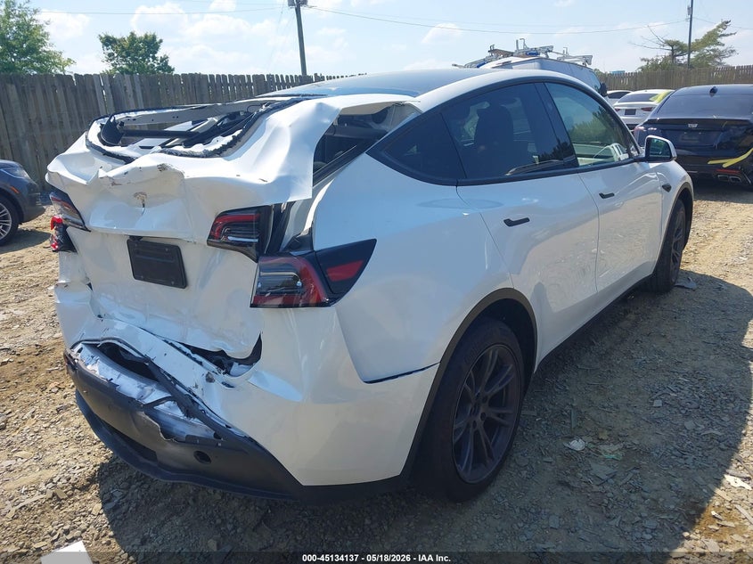 2024 Tesla Model y VIN 7SAYGDEDXRF205893 IAAI salvage auction — REAR END, Salvage Title, sold $9,300 on 2026-08-01 (photo 4)