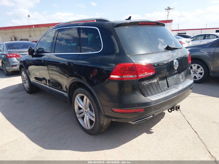 2011 Volkswagen Touareg VIN WVGFK9BP7BD005786 IAAI salvage auction — NORMAL WEAR, Original (Texas), sold $550 on 2026-08-10 (photo 3)