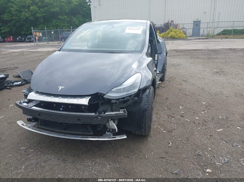 2024 Tesla Model y VIN 7SAYGDEE8RA296281 IAAI salvage auction — ALL OVER, Salvage Title, sold $8,500 on 2026-07-15 (photo 2)