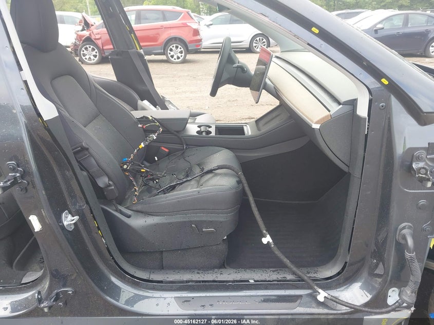2024 Tesla Model y VIN 7SAYGDEE8RA296281 IAAI salvage auction — ALL OVER, Salvage Title, sold $8,500 on 2026-07-15 (photo 5)