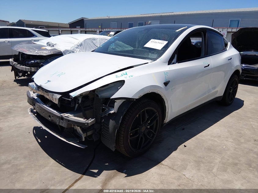 2023 Tesla Model y VIN 7SAYGDEE4PA076343 IAAI salvage auction — FRONT & REAR, Original (Texas), sold $9,050 on 2026-07-07 (photo 2)