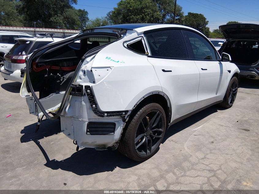 2023 Tesla Model y VIN 7SAYGDEE4PA076343 IAAI salvage auction — FRONT & REAR, Original (Texas), sold $9,050 on 2026-07-07 (photo 4)